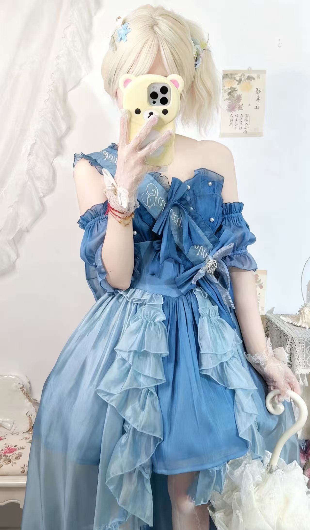 Design Concept:

This Classic Lolita charming blue dress set features delicate lace trim and bow details, combining elegance with a cute and refined style. The soft blue tone adds a graceful touch, perfect for creating a timeless Lolita look. Product Details: The set includes a dress, matching wrist sleeves, and a ribbon sash, offering a coordinated ensemble that embodies classic Lolita charm.