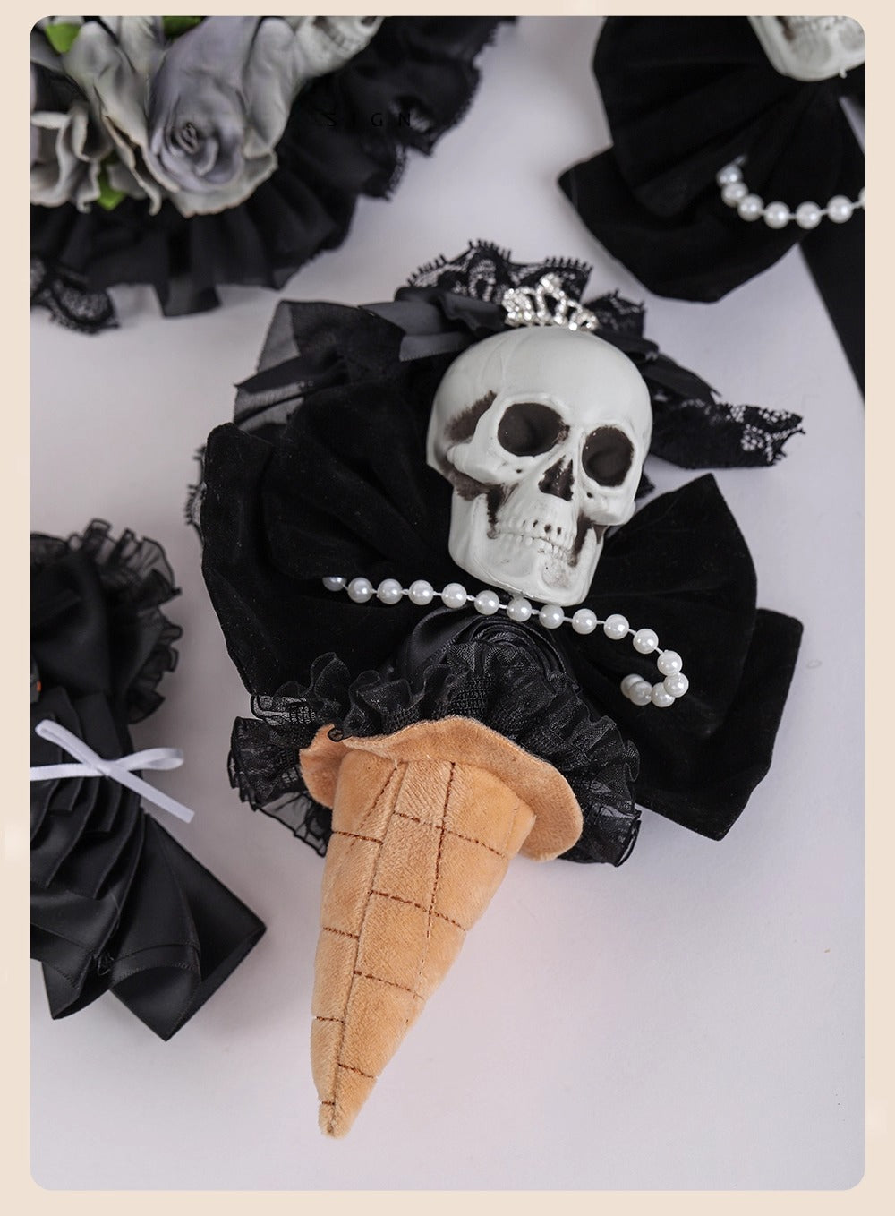 Design Concept:
This accessory blends gothic elegance with a playful twist, featuring a Skull Bride cone handheld design. Crafted in black lace with delicate detailing, it reflects both dark fantasy and vintage charm. The cone-shaped handheld piece captures the essence of Gothic Lolita aesthetics while adding a unique statement for cosplay, themed events, or collection display.This product is a presale item, allowing you to secure a piece of artistry ahead of time.