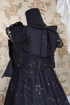 Design Concept:

This Gothic Lolita JSK dress in classic black features a three-tier frill design with foil-printed ribbon details. The layered ruffles create a dramatic and elegant silhouette, perfectly capturing the Gothic princess aesthetic. Crafted with attention to detail, the dress combines sophistication with a charming, dark Lolita vibe. Ideal for special occasions, cosplay, or completing a Gothic Lolita wardrobe, this JSK offers both style and timeless elegance.