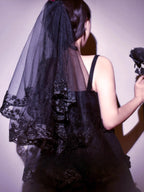 Design Concept:
This Gothic Lolita veil embodies a mysterious dark elegance with a punk-inspired twist. Crafted in deep black, the long nun-style veil flows gracefully, creating a dramatic silhouette that enhances Gothic, Punk, and Lolita aesthetics. Perfect for Halloween, cosplay, or themed photoshoots, this versatile accessory adds a hauntingly beautiful touch to any outfit, making it an essential piece for those who love bold and striking fashion statements.