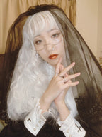Design Concept:
This Gothic Lolita veil embodies a mysterious dark elegance with a punk-inspired twist. Crafted in deep black, the long nun-style veil flows gracefully, creating a dramatic silhouette that enhances Gothic, Punk, and Lolita aesthetics. Perfect for Halloween, cosplay, or themed photoshoots, this versatile accessory adds a hauntingly beautiful touch to any outfit, making it an essential piece for those who love bold and striking fashion statements.