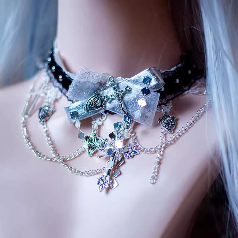 Design Concept:

This Gothic Lolita necklace combines dark elegance with mystical charm. Crafted in black, the accessory features a six-pointed star and skeleton-inspired design, accented with a delicate bow and cross pendant. Perfect for Halloween, cosplay, or adding a dramatic Gothic touch to Lolita and Y2K fashion, this necklace enhances any outfit with a mysterious, enchanting flair.