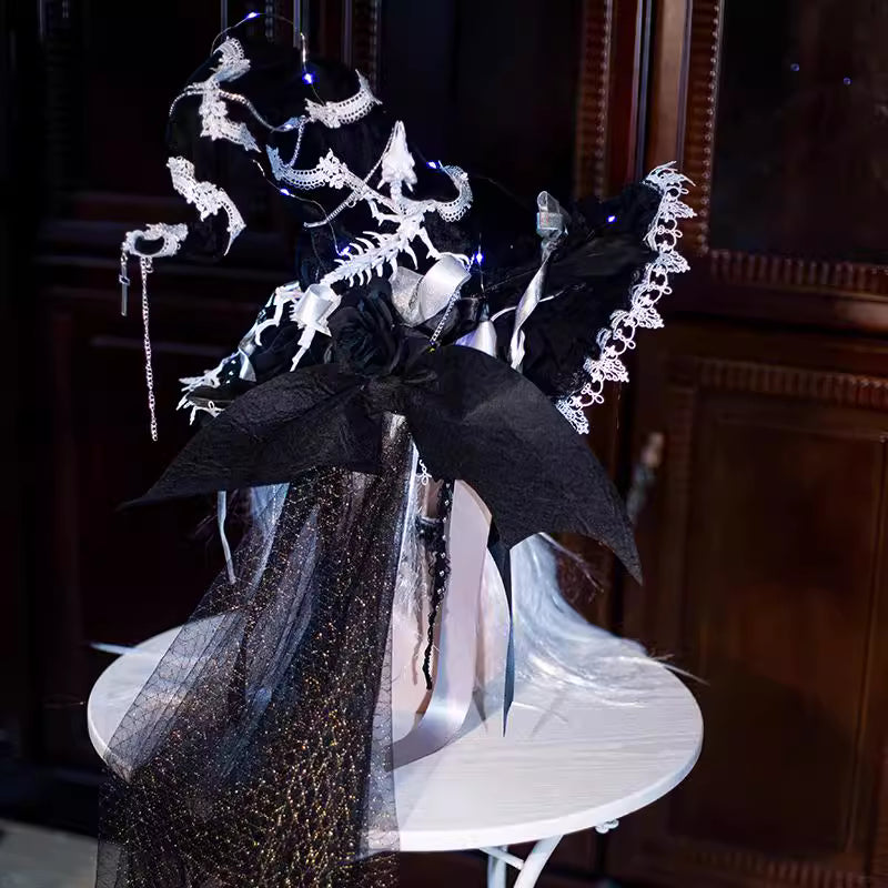 Design Concept:

This Gothic Lolita witch hat merges dark elegance with mystical charm. Available in black and white, the hat is handcrafted with intricate details, featuring a six-pointed star motif and a subtle skeleton-inspired structure for a dramatic effect. There are two distinct styles: one is a classic witch hat, and the other includes bat wings and an attached veil for an extra theatrical Gothic flair. Ideal for Halloween, cosplay, themed photoshoots, or adding a whimsical Gothic touch to Lolita fa