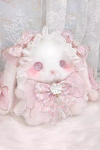 Design Concept:

This adorable Lolita bag brings a playful and sweet touch to any outfit. Crafted in soft pink, it features a charming short-eared rabbit doll design, delicate lace trim, and a cute ribbon accent for extra feminine appeal. The compact size makes it perfect for carrying essentials while complementing your Lolita or kawaii ensemble. Ideal for daily outings, tea parties, or cosplay events, this bag combines practicality with whimsical charm.