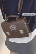 Design Concept:

This charming Lolita messenger bag blends playful Japanese school style with sweet, feminine details. Featuring a printed design and a classic messenger silhouette, it adds a stylish touch to any Lolita or casual outfit. Available in two sizes—large and small—the bag accommodates different carrying needs, while the sturdy handle ensures comfortable use. Choose from two versatile colors, black and brown, to match a variety of looks. Perfect for daily outings, school-inspired Lolita coordinat