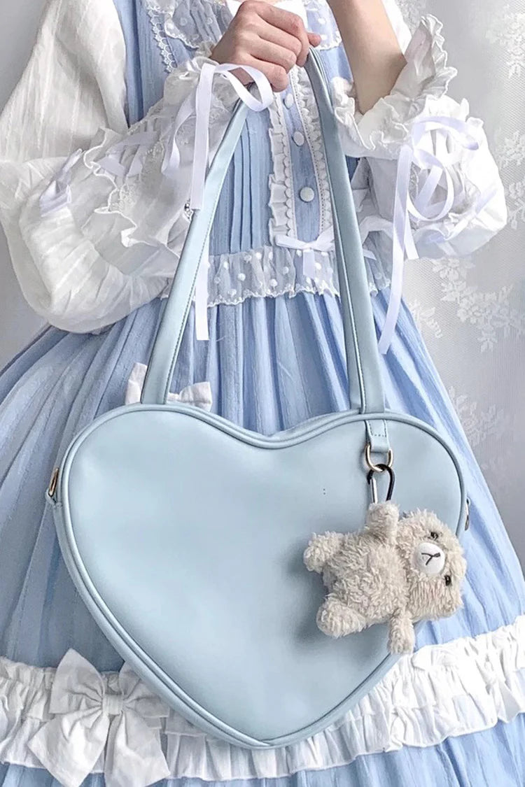 Design Concept:

This charming Lolita crossbody bag combines simplicity with sweet, playful charm. Crafted with a solid color design and a cute heart accent, it adds a touch of feminine elegance to any outfit. The compact size makes it perfect for carrying essentials, while the adjustable strap ensures comfortable wear. Available in four delightful colors—blue, white, pink, and yellow—this bag complements a variety of Lolita styles, making it ideal for daily wear, tea parties, or casual outings.