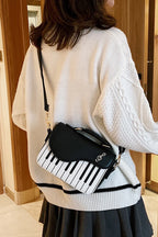 Design Concept:

This delightful Lolita crossbody bag combines musical charm with classic sweet style. Crafted with delicate piano note embroidery, it adds a whimsical and elegant touch to any outfit. The compact design makes it perfect for carrying essentials, while the adjustable strap ensures comfortable wear. Available in three versatile colors—black, pink, and brown—this bag complements a variety of Lolita coordinates, making it ideal for daily outings, music-themed events, or tea parties.