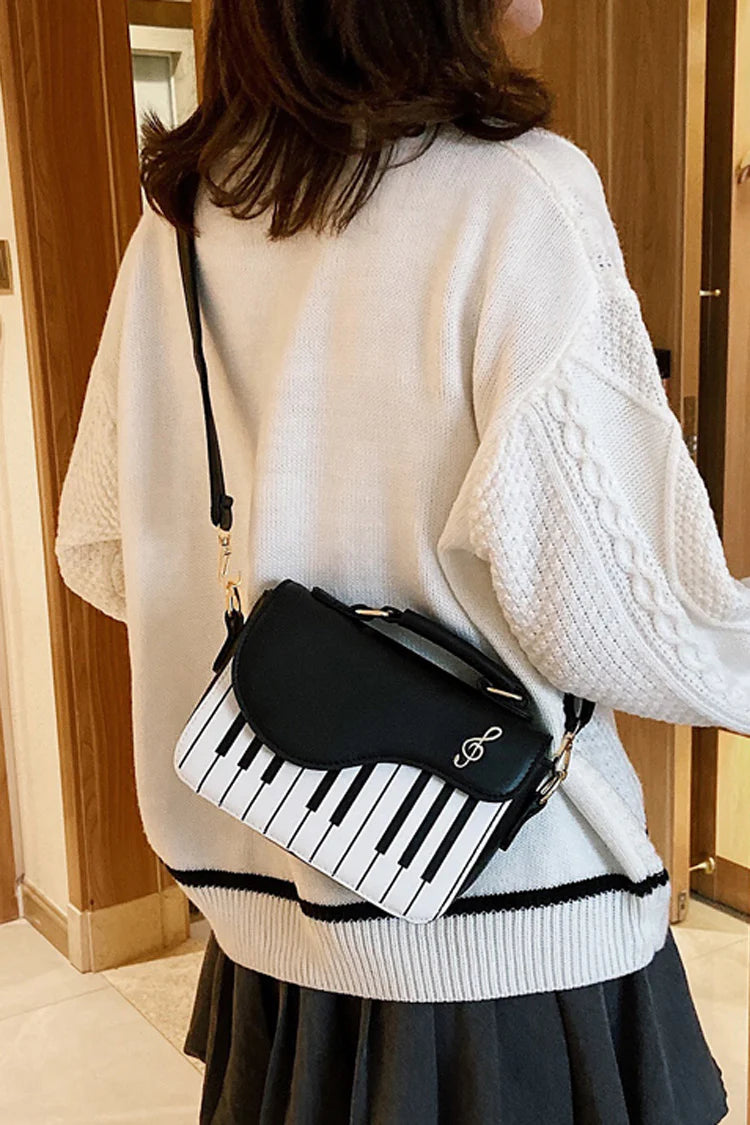 Design Concept:

This delightful Lolita crossbody bag combines musical charm with classic sweet style. Crafted with delicate piano note embroidery, it adds a whimsical and elegant touch to any outfit. The compact design makes it perfect for carrying essentials, while the adjustable strap ensures comfortable wear. Available in three versatile colors—black, pink, and brown—this bag complements a variety of Lolita coordinates, making it ideal for daily outings, music-themed events, or tea parties.