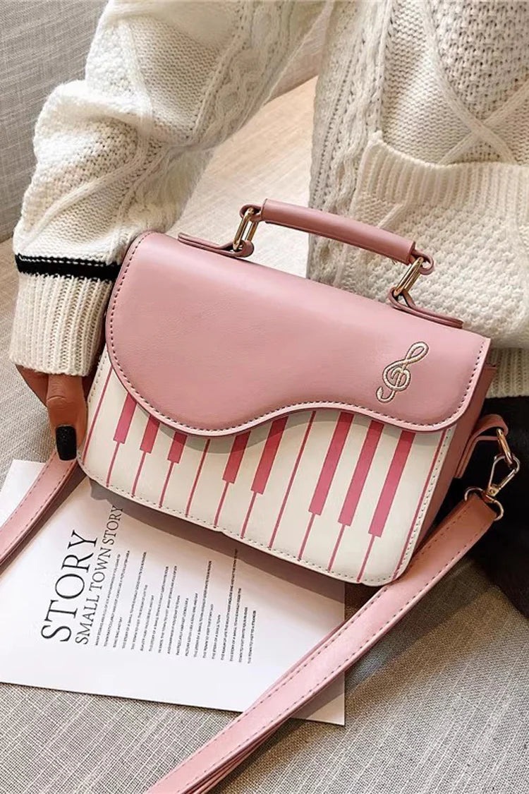 Design Concept:

This delightful Lolita crossbody bag combines musical charm with classic sweet style. Crafted with delicate piano note embroidery, it adds a whimsical and elegant touch to any outfit. The compact design makes it perfect for carrying essentials, while the adjustable strap ensures comfortable wear. Available in three versatile colors—black, pink, and brown—this bag complements a variety of Lolita coordinates, making it ideal for daily outings, music-themed events, or tea parties.