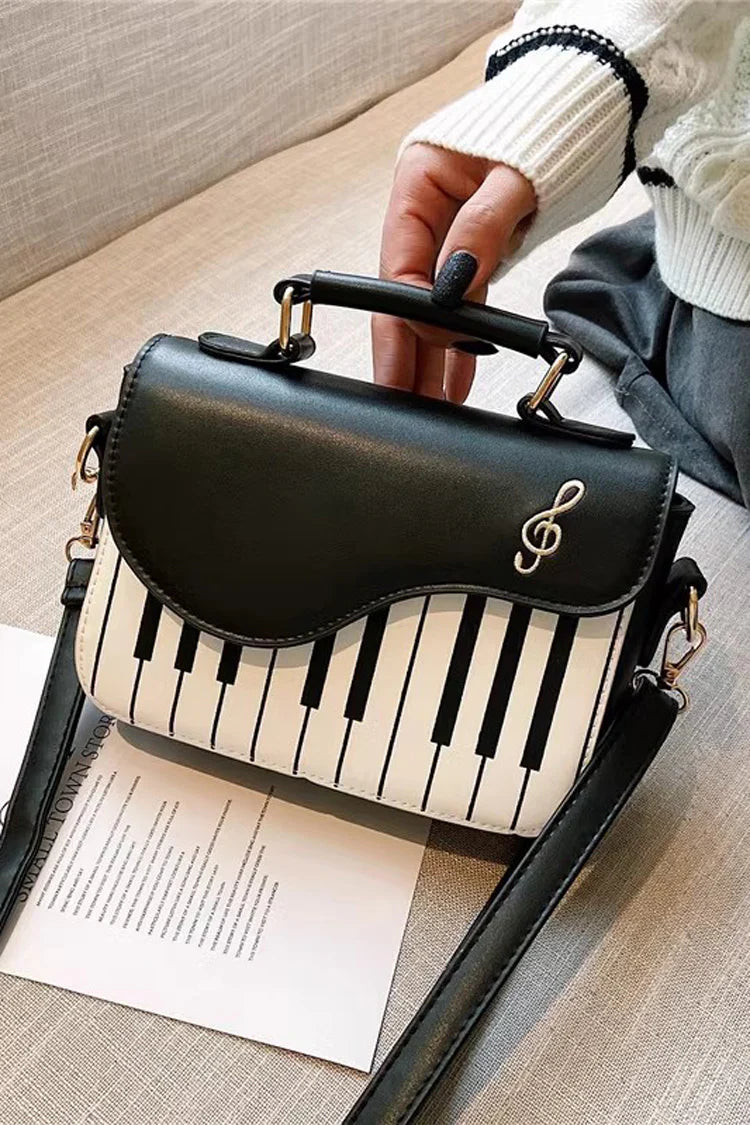 Design Concept:

This delightful Lolita crossbody bag combines musical charm with classic sweet style. Crafted with delicate piano note embroidery, it adds a whimsical and elegant touch to any outfit. The compact design makes it perfect for carrying essentials, while the adjustable strap ensures comfortable wear. Available in three versatile colors—black, pink, and brown—this bag complements a variety of Lolita coordinates, making it ideal for daily outings, music-themed events, or tea parties.