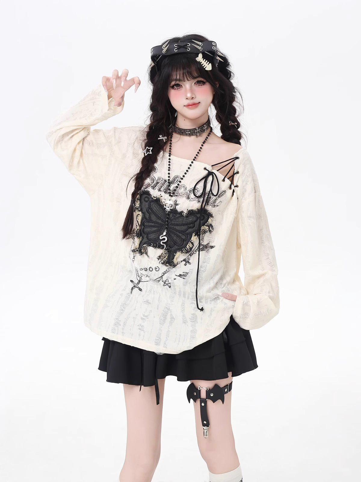 This apricot Lolita blouse blends retro sweetness with a touch of edgy design. Featuring delicate butterfly patch embellishments, distressed details, and lace-up accents, the piece captures both elegance and rebellious charm. The loose fit and long sleeves ensure a comfortable, effortless wear, perfect for early autumn layering. Ideal for casual outings or streetwear looks, this top adds a playful yet stylish twist to everyday fashion.