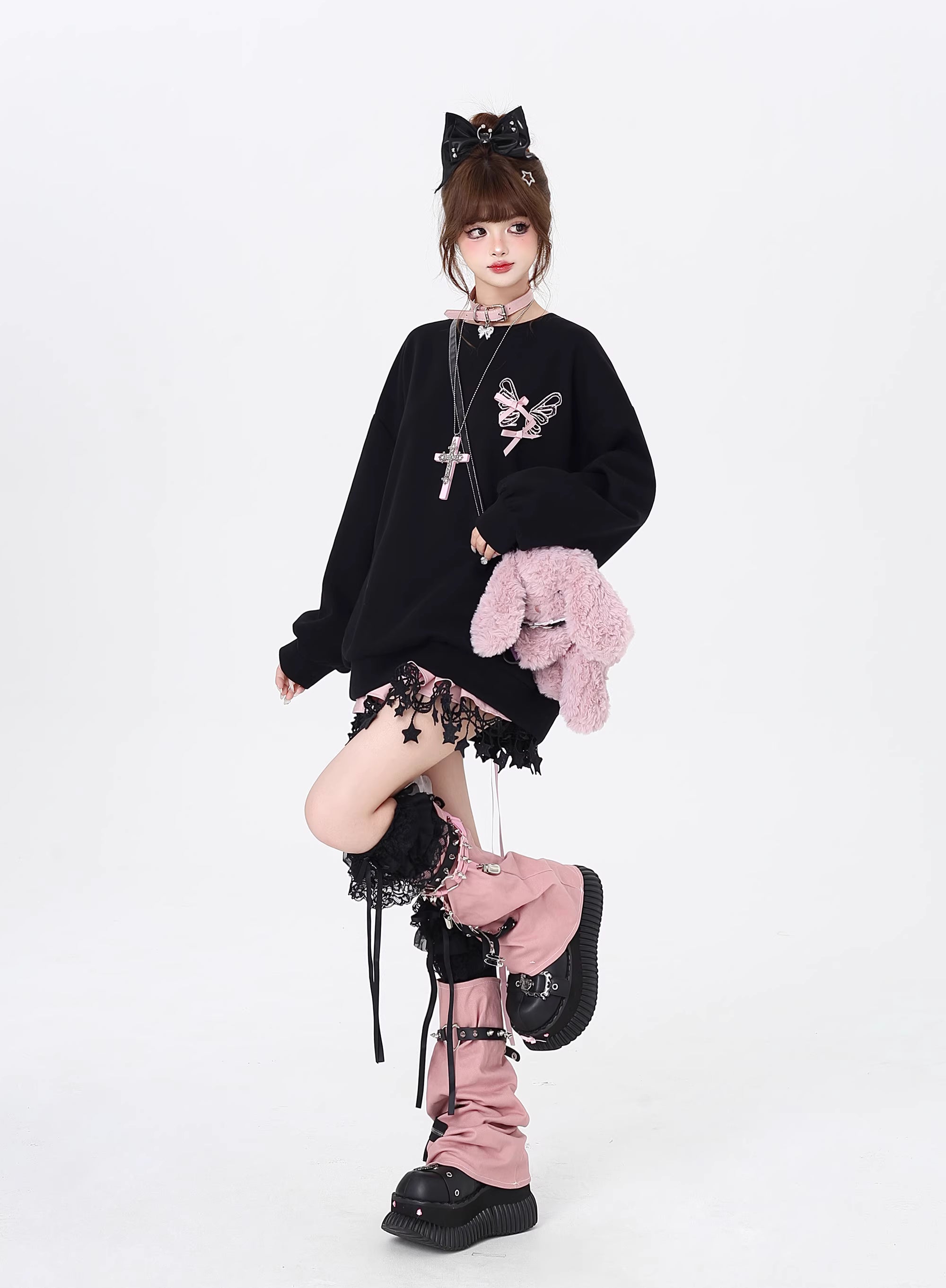 This Lolita blouse-style crewneck sweatshirt comes in soft pink and classic black, blending sweet charm with a cool casual vibe. Designed with delicate bow tie-up details, it adds a playful and feminine touch while keeping a relaxed, loose fit that’s perfect for layering in autumn. Comfortable yet stylish, it’s ideal for casual outings, daily wear, or pairing with Lolita-inspired coordinates for a cozy seasonal look.