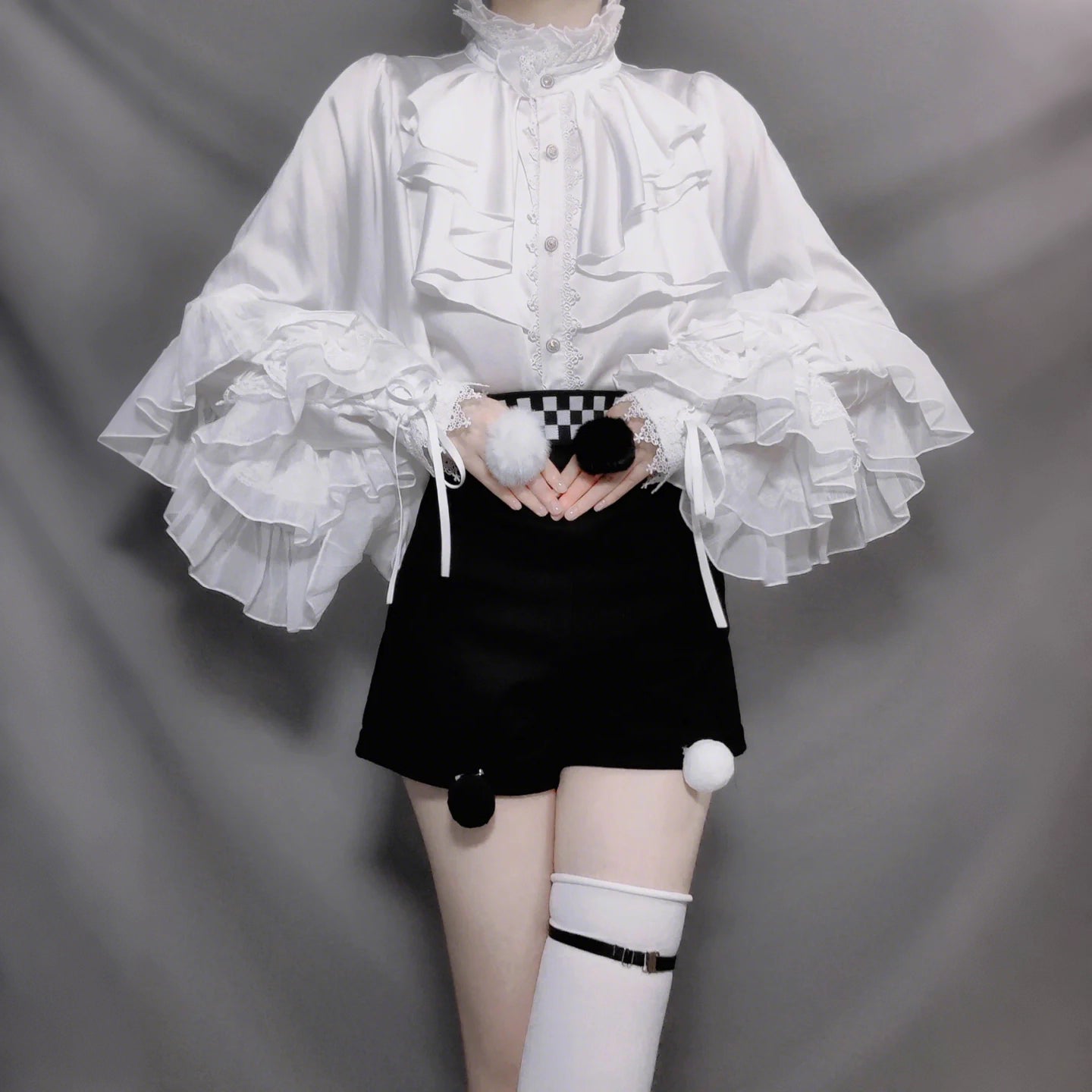 Design Concept:

This Lolita blouse features dramatic bat sleeves with a Gothic medieval charm, blending elegance and boldness in one piece. Available in red, white, apricot, black, and silver, it offers versatile styling for different moods and occasions. The soft yet structured fabric ensures comfort while maintaining a vintage silhouette, perfect for pairing with Lolita skirts, shorts, or layered coordinates. Whether for daily wear, themed gatherings, or cosplay events, this blouse adds a striking statem