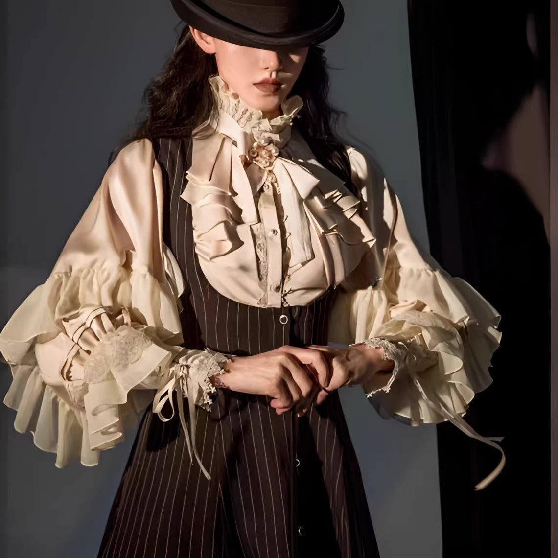 Design Concept:

This Lolita blouse features dramatic bat sleeves with a Gothic medieval charm, blending elegance and boldness in one piece. Available in red, white, apricot, black, and silver, it offers versatile styling for different moods and occasions. The soft yet structured fabric ensures comfort while maintaining a vintage silhouette, perfect for pairing with Lolita skirts, shorts, or layered coordinates. Whether for daily wear, themed gatherings, or cosplay events, this blouse adds a striking statem