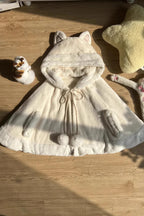 This Lolita coat in ivory features an adorable hood with kitty ears, designed in a sweet cape style. The cloak overcoat silhouette creates a soft and elegant flow, while the playful details highlight the charming Lolita aesthetic. Perfect for autumn and winter, it provides both warmth and cuteness, making it an ideal outerwear choice for pairing with Lolita dresses and accessories.