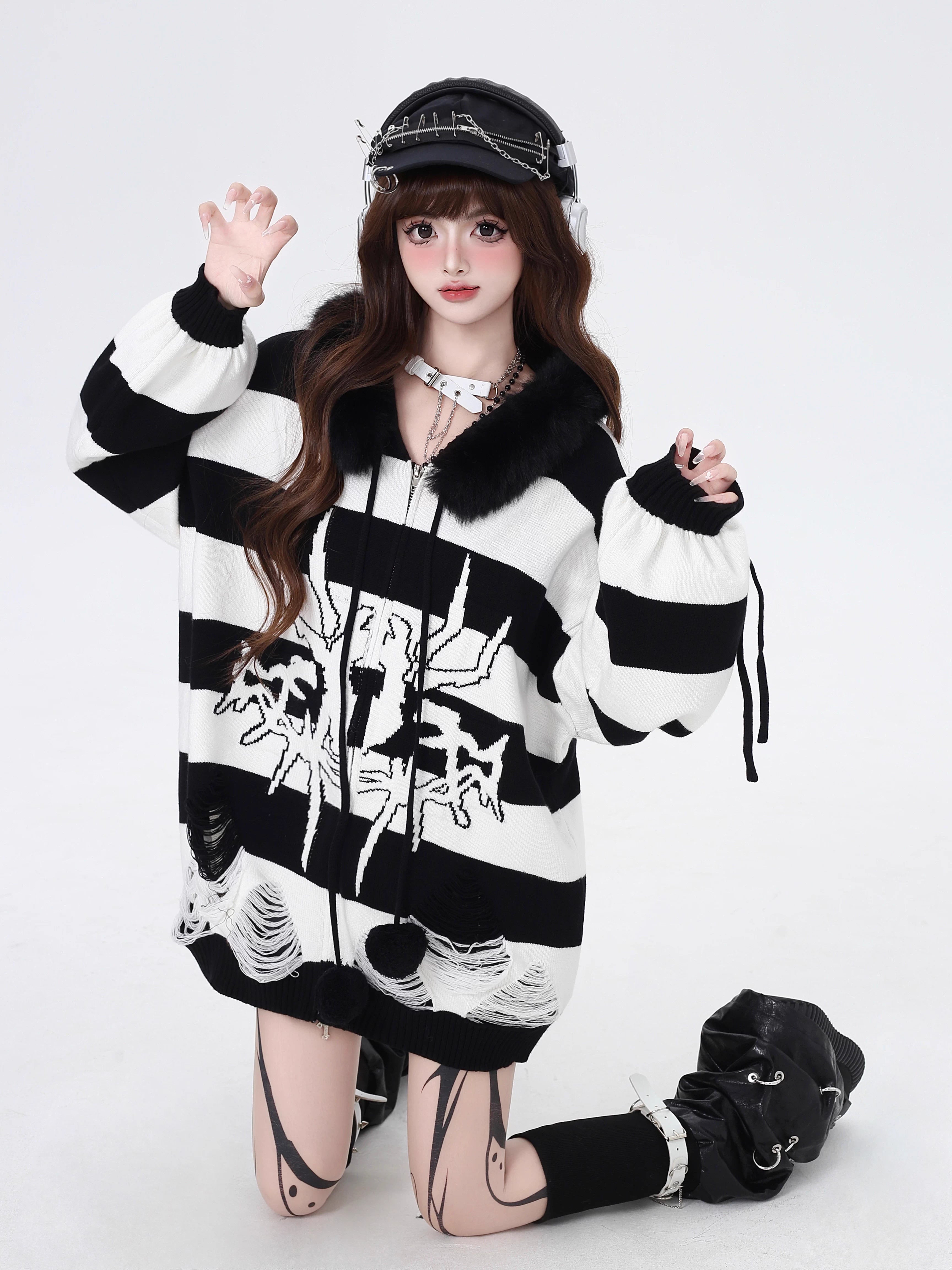 Design Concept:
This Lolita coat series fuses Gothic punk style with cozy winter functionality. Designed in black with purple, white, and gray striped variations, the cardigan sweater features a detachable faux fur collar, lantern sleeves, and a loose hooded design. The detachable collar allows you to switch between a bold streetwear look and a softer, cozier winter vibe.&nbsp;Crafted from soft knit fabric, this piece ensures both comfort and warmth during colder days. Perfect for casual winter streetwear, 