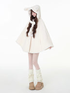 Design Concept:
This Light Apricot Lolita Coat features a charming bunny ear hood design, crafted from soft, high-quality wool for cozy warmth during winter. Designed in a loose-fit cape style, it allows for comfortable layering while maintaining a cute, playful aesthetic. The coat does not include a plush scarf, but comes with a removable decorative bow, adding an extra touch of sweet elegance to your outfit. Perfect for daily wear or casual outings in the colder months.