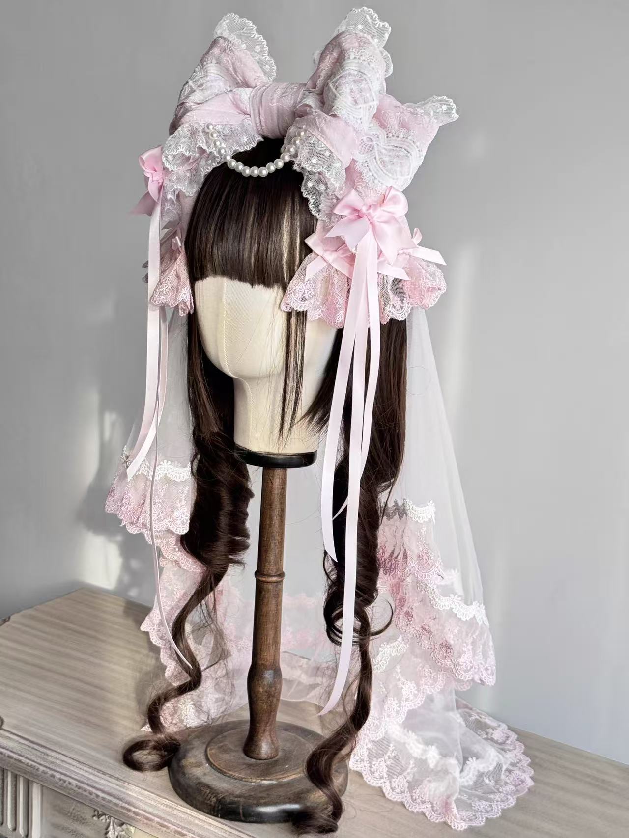 Design Concept:


This Lolita hair accessories set includes a delicate bowknot hair clip (KC) paired with a soft matching veil, creating an elegant and dreamy style. Available in three colors—white, pink, and blue—each design captures a sweet and graceful charm, making it a versatile choice for coordinating with different Lolita outfits.