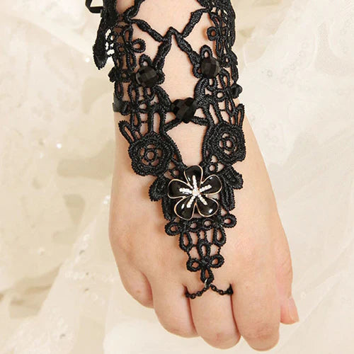 Design Concept:


Elevate your Gothic Lolita style with this black vintage-inspired lace floral ring bracelet. Designed with intricate lace and delicate flower accents, it exudes both elegance and mystery. The connected ring and bracelet design creates a dramatic, graceful silhouette that enhances any outfit. Perfect for tea parties, cosplay, stage performances, or daily coordinates, this accessory adds a timeless Gothic charm and refined femininity to your look.