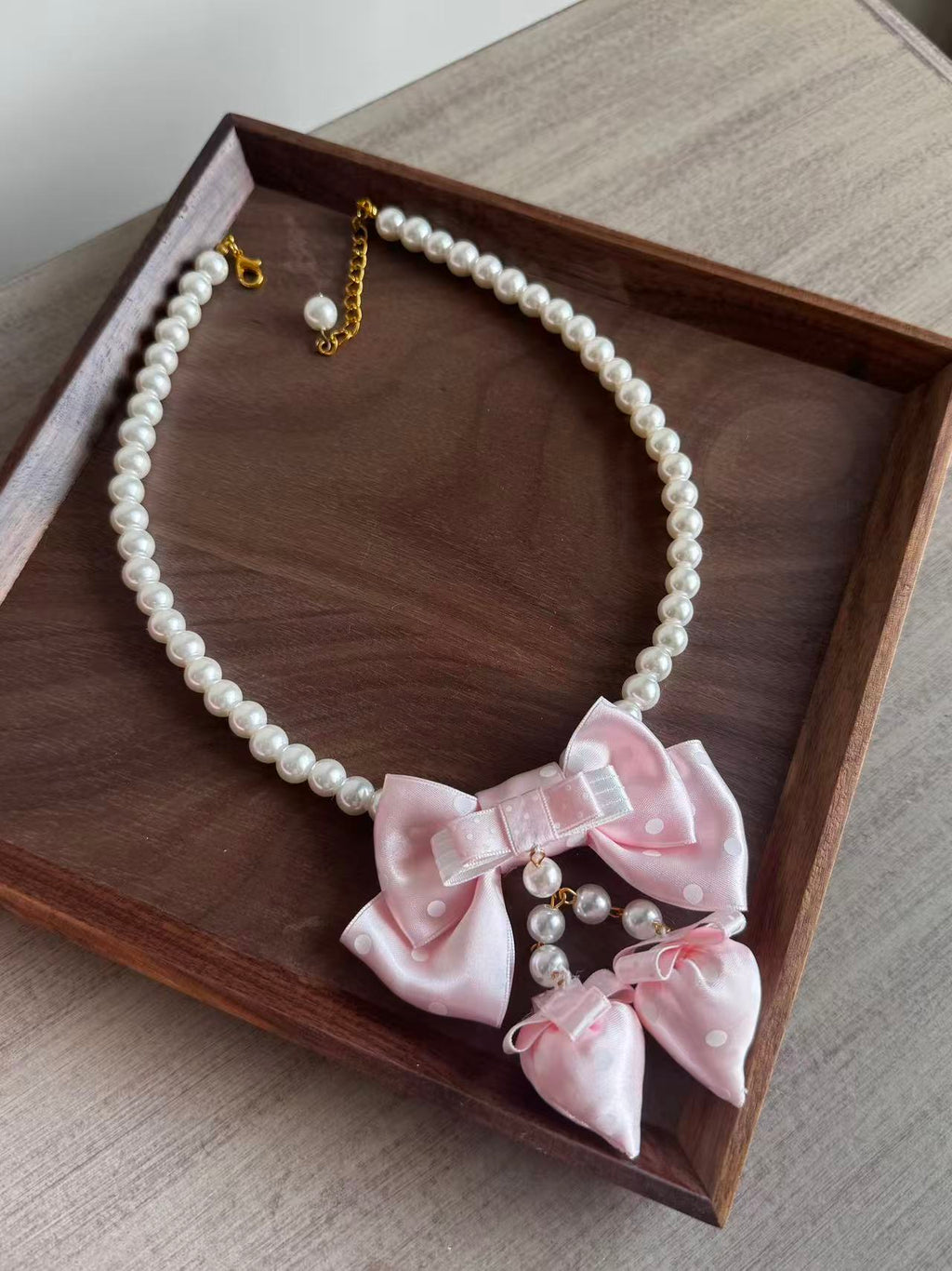 Design Concept:


This Lolita necklace collection features four charming styles, each adorned with a playful strawberry pendant and delicate pearl accents. Available in red polka dots, wine red polka dots, pink polka dots, and blue polka dots, these necklaces bring a sweet and versatile touch to daily outfits while capturing the whimsical essence of Lolita fashion.