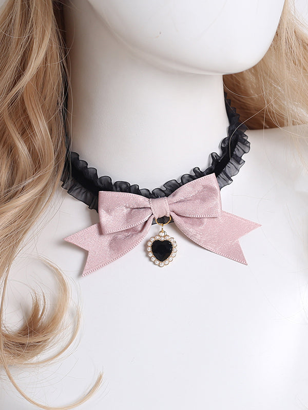 Design Concept:
This Lolita necklace collection comes in two charming variations. The dark pink version features a delicate lace choker adorned with a black heart pendant, while the light pink version is styled with a graceful pearl pendant. Both designs are accented with bow details, creating a sweet and elegant Lolita accessory perfect for completing a lovely outfit.