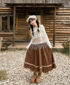 Design Concept:
This Lolita skirt in classic brown and khaki tones is crafted with a soft, flowing fabric, featuring delicate lace trim along the hemline. The long A-line silhouette combines vintage elegance with everyday practicality, offering a flattering high-waist design that elongates the figure. Its versatile solid color design makes it easy to pair with blouses or coats, creating both simple daily outfits and refined Lolita coordinates. Perfect for autumn gatherings, tea parties, or casual outings, t