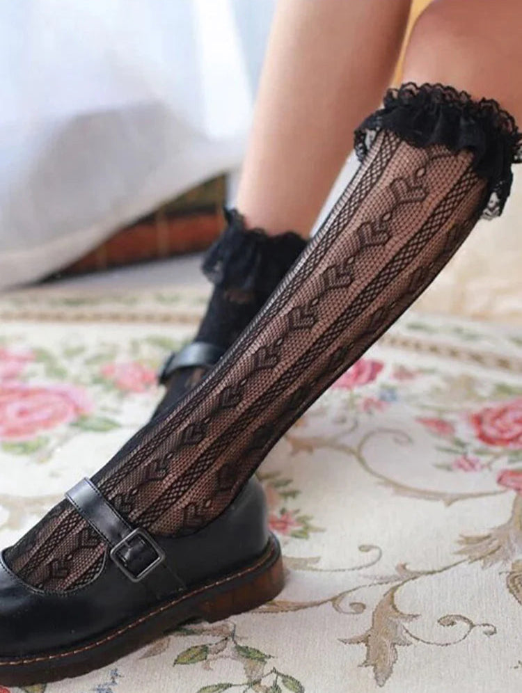 Design Concept:


These Lolita socks combine elegance with playful charm. Crafted in black or white, they feature heart-shaped lace detailing and a hollow mid-tube design, adding a delicate and whimsical touch to any outfit. The stretchy material ensures a comfortable fit while maintaining their shape, making them perfect for pairing with skirts, dresses, or cosplay ensembles. Ideal for completing sweet, romantic, or classic Lolita looks, these socks are both stylish and versatile.