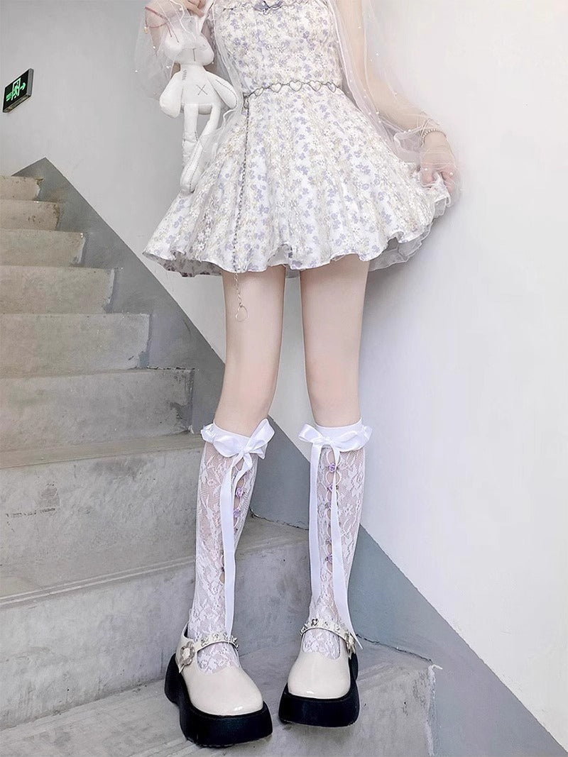 Design Concept:


These Lolita stockings are designed with delicate lace flowers and charming bow ribbon ties, available in black and white. The mid-calf length creates a sweet and elegant silhouette, perfect for pairing with Lolita dresses and skirts. Crafted with soft fabric and detailed lace edging, they bring out a cute Japanese-inspired Lolita aesthetic, making them ideal for both daily wear and cosplay styling.