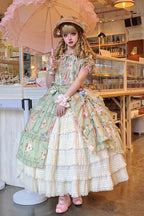 Design Concept:

Bring a touch of everyday charm to your wardrobe with this Classic Lolita green dress. Featuring short sleeves, a delicate printed pattern, ruffled trim, bow accents, and a stylish cardigan-style overlay, it perfectly balances sweet elegance with casual wearability. The soft green hue adds a fresh and gentle feel, while the flattering silhouette ensures comfort and style. Ideal for daily outings, tea parties, or casual themed gatherings, this dress combines classic Lolita aesthetics with pr