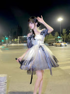 This Hime Lolita JSK dress features an ink-gradient design in soft, watercolor-inspired tones, accented with charming ribbon details and a strawberry princess motif. The short silhouette enhances a sweet and playful look, perfect for summer or spring styling. Crafted with delicate fabrics and attention to detail, this dress combines elegance with a whimsical Lolita aesthetic. Ideal for cosplay, special occasions, or completing a sweet Lolita wardrobe, it offers both style and charm.