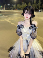 This Hime Lolita JSK dress features an ink-gradient design in soft, watercolor-inspired tones, accented with charming ribbon details and a strawberry princess motif. The short silhouette enhances a sweet and playful look, perfect for summer or spring styling. Crafted with delicate fabrics and attention to detail, this dress combines elegance with a whimsical Lolita aesthetic. Ideal for cosplay, special occasions, or completing a sweet Lolita wardrobe, it offers both style and charm.