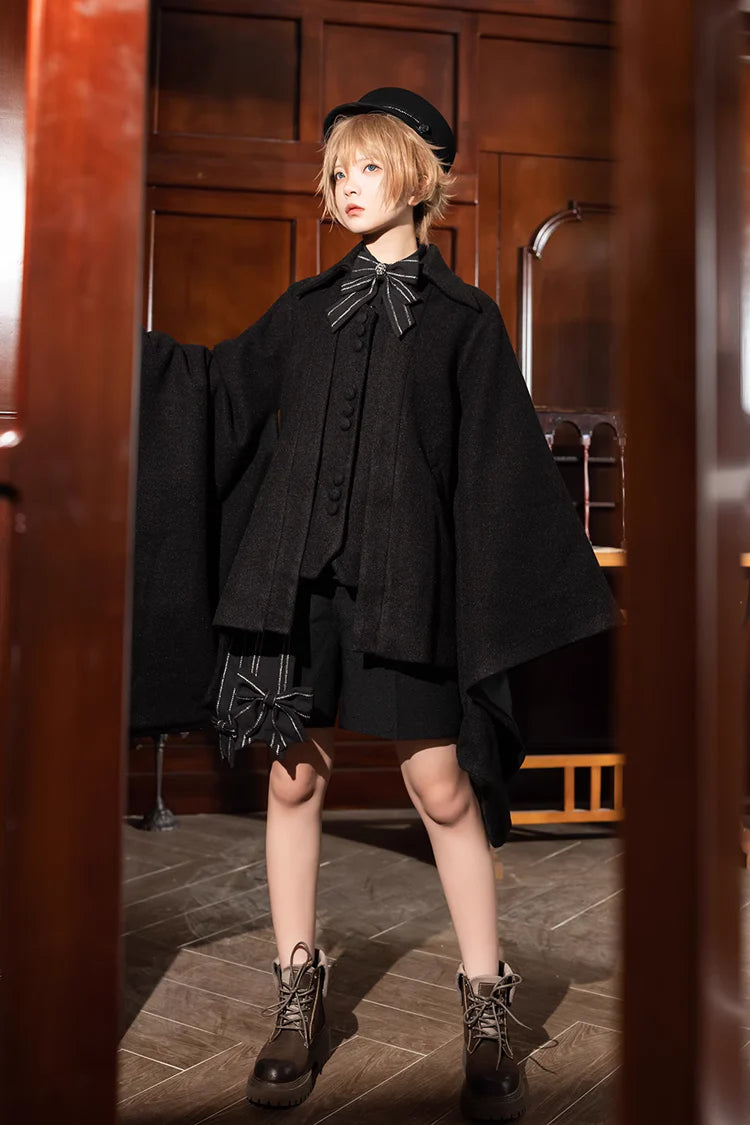 Design Concept:

This Lolita coat in classic black features a vintage Ouji-inspired design with oversized wide sleeves. Made from soft wool fabric, it offers both warmth and elegance for autumn and winter wear. The loose silhouette creates a graceful flow, while the retro details highlight a noble and stylish Lolita aesthetic. Perfect for pairing with dresses, skirts, or formal Lolita outfits, this overcoat combines comfort, functionality, and timeless charm.