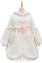 Design Concept:

This adorable Lolita longline coat brings whimsical charm to everyday wear. Crafted from soft ivory fabric, it features a playful hood adorned with long rabbit ears, delicate ruffle trim, and a charming ribbon accent at the front. The long silhouette provides both comfort and elegance, making it perfect for layering over dresses or skirts. Ideal for daily Lolita styling, this coat combines cute details with practical warmth, creating a sweet and enchanting look.