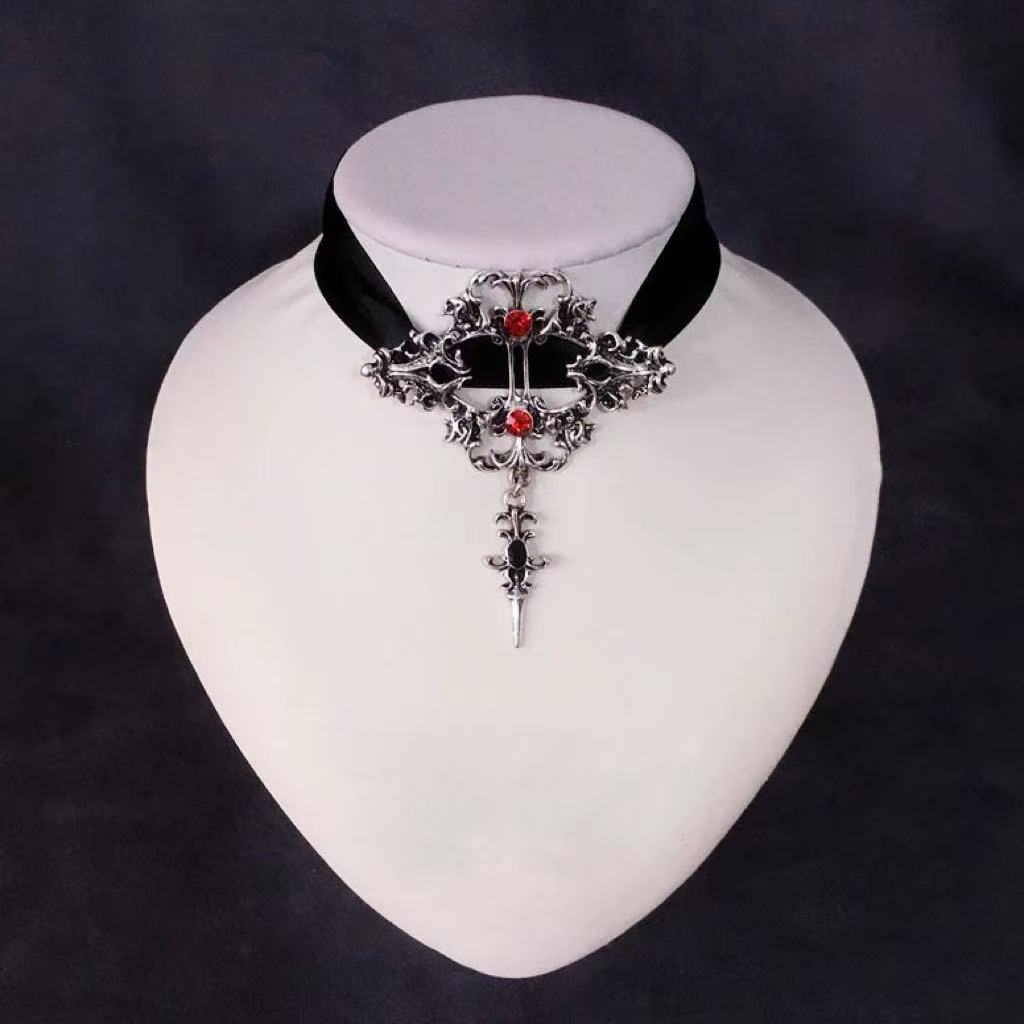 Design Concept:


Embrace a bold and alternative aesthetic with this striking Gothic Punk necklace. Crafted in a deep black hue, this choker-style piece is designed to make a statement, perfectly blending Y2K edge with subculture-inspired Lolita fashion. The centerpiece of the design is a prominent cross pendant, symbolizing a classic dark romanticism. Adding a customizable and edgy touch are the functional lace-up details, allowing you to adjust the fit for a personalized look.