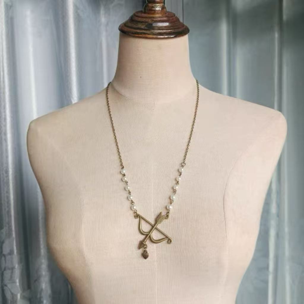 Design Concept:


Capture the essence of sweet romance with this delicately crafted Lolita necklace. The centerpiece of the design is a charming "Arrow of Love" pendant, symbolically representing Cupid's arrow and the blossoming of affection. Crafted in a warm golden tone, this piece adds a touch of classic elegance to any coord. The dainty chain and subtle design make it a perfect accessory for expressing a heartfelt and romantic sentiment within the Lolita fashion style.
