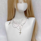 Design Concept:


This Lolita necklace features a pure white gothic choker design adorned with a cross pendant, blending elegance with a refined Lolita aesthetic. Available in two versions—the standard edition and the upgraded edition—each offers a unique style and quality, making it a versatile accessory for completing classic or gothic Lolita outfits.