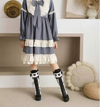Design Concept:

Discover the perfect fusion of Gothic and Knight style with these black tall boots, expertly designed for petite women to create a slimming and lengthening silhouette. Crafted from high-quality synthetic leather with a sleek finish, these boots feature a comfortable flat heel and a convenient side zipper for easy wear. Their versatile knight boot design effortlessly complements any Lolita coordinate, adding a touch of elegant edge to your wardrobe for a truly striking statement.