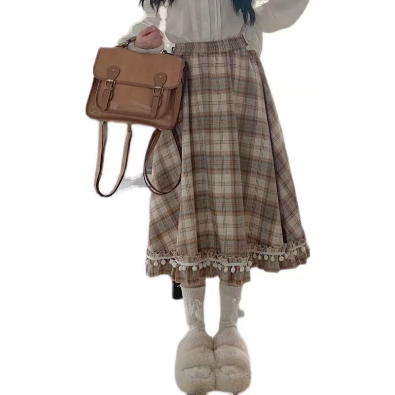 Design Concept:
This vintage-inspired Lolita skirt in a classic plaid wool fabric captures both warmth and elegance. The playful pom-pom accents add a unique touch of charm, while the flattering high-waist A-line cut creates a graceful silhouette. Perfect for daily wear or winter gatherings, the skirt blends retro details with cozy textures, making it an essential piece for an elegant Lolita wardrobe.