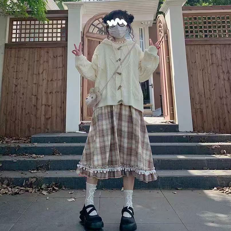 Design Concept:
This vintage-inspired Lolita skirt in a classic plaid wool fabric captures both warmth and elegance. The playful pom-pom accents add a unique touch of charm, while the flattering high-waist A-line cut creates a graceful silhouette. Perfect for daily wear or winter gatherings, the skirt blends retro details with cozy textures, making it an essential piece for an elegant Lolita wardrobe.