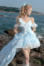 Design Concept:&nbsp;

Embrace a unique and enchanting style with this exquisite Sweet Lolita JSK dress. The beautiful blue base is elegantly adorned with delicate embroidery and intricate lace, adding a touch of refined sweetness. The design features charming ruffles and a distinctive irregular hemline, creating a dynamic and eye-catching silhouette. A key highlight of this dress is the elegant detachable train, which adds a dramatic and graceful touch for special occasions, allowing you to customize your 