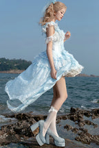 Design Concept:&nbsp;

Embrace a unique and enchanting style with this exquisite Sweet Lolita JSK dress. The beautiful blue base is elegantly adorned with delicate embroidery and intricate lace, adding a touch of refined sweetness. The design features charming ruffles and a distinctive irregular hemline, creating a dynamic and eye-catching silhouette. A key highlight of this dress is the elegant detachable train, which adds a dramatic and graceful touch for special occasions, allowing you to customize your 