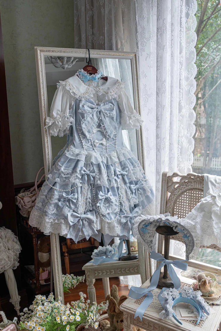Design Concept:
Embrace a graceful and romantic style with this Sweet Lolita blue JSK dress. Designed with a sleeveless cut, cascading ruffles, and fine lace trimming, it captures an air of elegance and sweetness. The bow embellishments add a charming touch, while the layered silhouette flows beautifully for a fairytale-like appearance. Perfect for tea parties, garden strolls, or themed events, this lovely blue dress brings a soft and enchanting presence to any Lolita outfit.