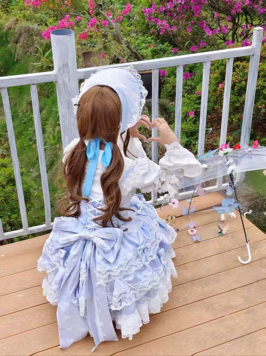 Design Concept:
Embrace a graceful and romantic style with this Sweet Lolita blue JSK dress. Designed with a sleeveless cut, cascading ruffles, and fine lace trimming, it captures an air of elegance and sweetness. The bow embellishments add a charming touch, while the layered silhouette flows beautifully for a fairytale-like appearance. Perfect for tea parties, garden strolls, or themed events, this lovely blue dress brings a soft and enchanting presence to any Lolita outfit.

