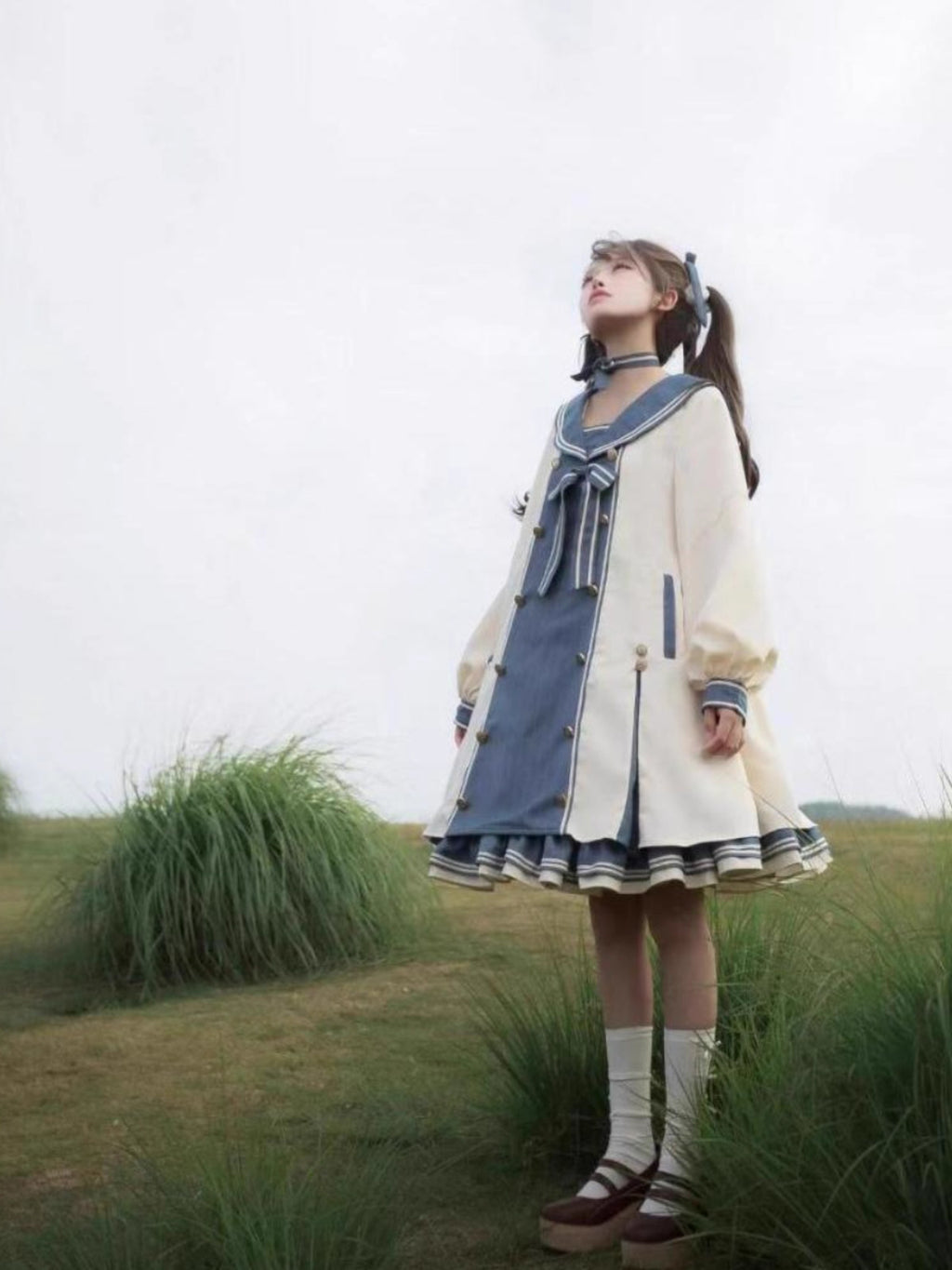 Design Concept:
This Sweet Lolita dress in charming blue is designed with a romantic sailor collar and delicate bow accents, creating a youthful and elegant look. The long sleeves provide a soft, flowing silhouette, while the loose princess-style cut offers both comfort and grace. With its dreamy layered skirt, this gown evokes a fairytale-like charm that perfectly suits daily wear, festive gatherings, or tea parties.