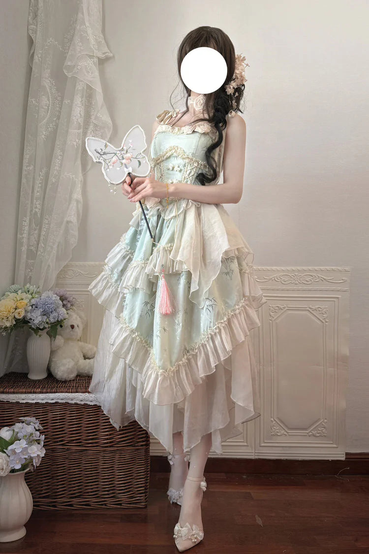 Design Concept:

This Sweet Lolita long JSK set combines elegant Chinese-inspired aesthetics with ballet Lolita charm. Crafted in a soft green jacquard fabric, the sleeveless design highlights the shoulders while the frilled trims and delicate bow lace details add a feminine and sweet touch. The asymmetric hemline creates a dynamic silhouette, enhancing the whimsical and graceful feel of the dress. Perfect for tea parties, cosplay, or Lolita gatherings, this long version set brings together traditional moti