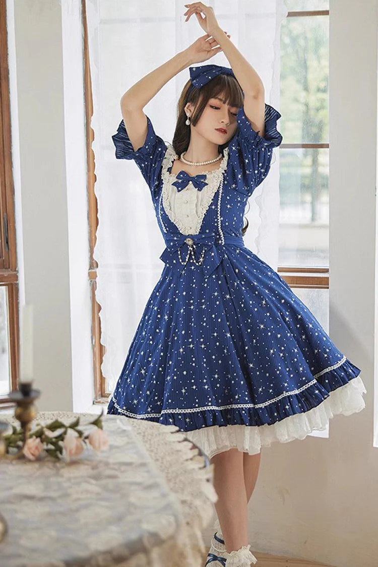 Design Concept:

This Sweet Lolita OP dress captures the dreamy essence of a midsummer galaxy night sky. Featuring a sparkling star pattern, it shimmers with celestial charm while maintaining a soft and sweet Lolita aesthetic. The short sleeves, delicate ruffles, and bow accents add playful elegance, creating a balanced design that feels both youthful and refined. With its flowing silhouette and detailed craftsmanship, this dress is perfect for tea parties, themed gatherings, or any special occasion where y
