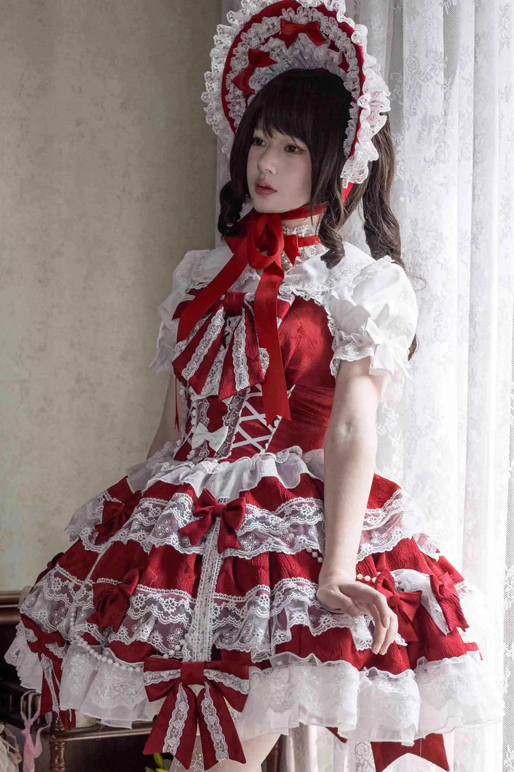 Design Concept:
Elevate your wardrobe with this Sweet Lolita red JSK dress, designed in a sleeveless style with layered ruffles, delicate lace, and dainty ribbon bow accents. The vibrant red hue brings a bold yet graceful charm, while the cascading silhouette creates a dreamy and romantic aesthetic. Perfect for tea parties, photoshoots, or elegant gatherings, this dress captures the essence of sweet Lolita fashion with its enchanting details and flattering design. Comfortable and versatile, it’s a must-have