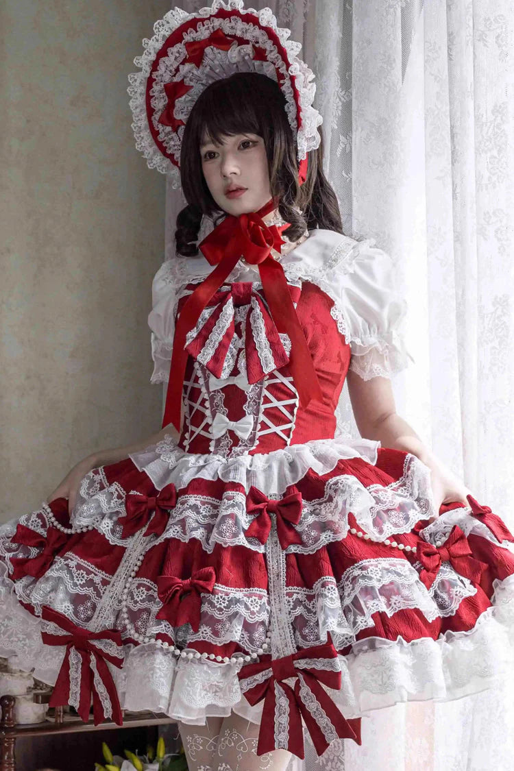 Design Concept:
Elevate your wardrobe with this Sweet Lolita red JSK dress, designed in a sleeveless style with layered ruffles, delicate lace, and dainty ribbon bow accents. The vibrant red hue brings a bold yet graceful charm, while the cascading silhouette creates a dreamy and romantic aesthetic. Perfect for tea parties, photoshoots, or elegant gatherings, this dress captures the essence of sweet Lolita fashion with its enchanting details and flattering design. Comfortable and versatile, it’s a must-have