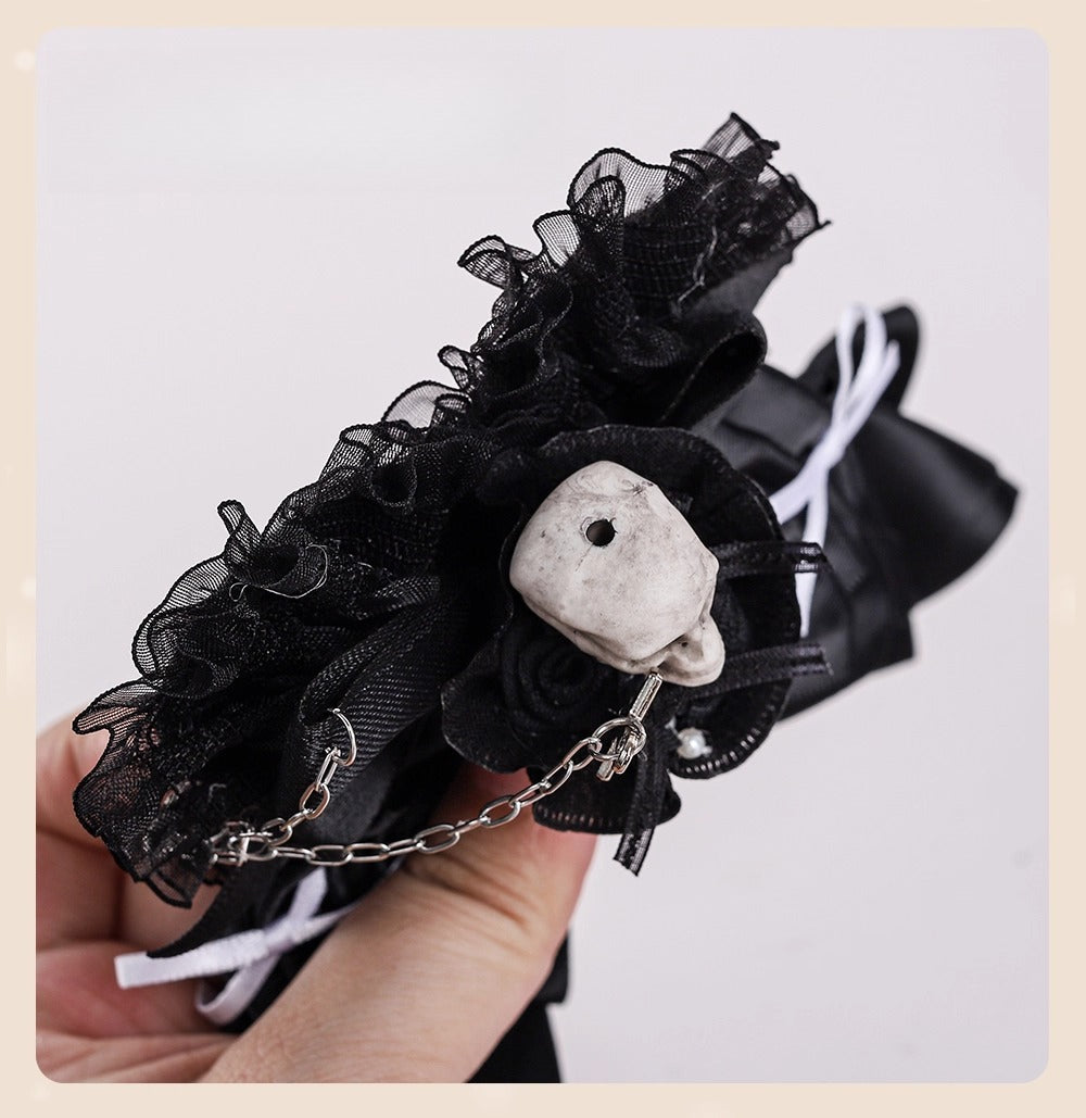 Design Concept:
This Gothic-inspired accessory embraces the eerie elegance of a Skull Bride theme. Crafted in black with a striking skull heart design, the piece is accented by a delicate cross motif, blending dark romance with Lolita charm. The lace details enhance its vintage flair, making it a statement piece for cosplay events, themed parties, or collectors of gothic accessories.