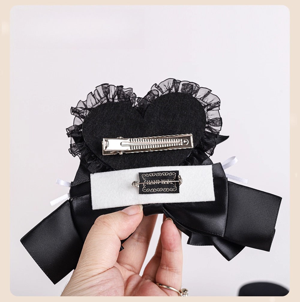 Design Concept:
This Gothic-inspired accessory embraces the eerie elegance of a Skull Bride theme. Crafted in black with a striking skull heart design, the piece is accented by a delicate cross motif, blending dark romance with Lolita charm. The lace details enhance its vintage flair, making it a statement piece for cosplay events, themed parties, or collectors of gothic accessories.